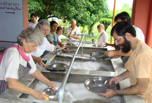 Devotees washing dishes