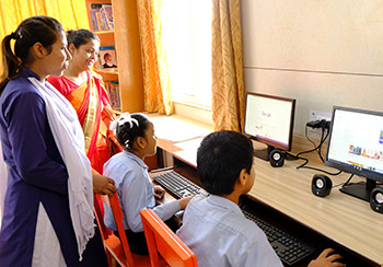 Teachers guiding computer students