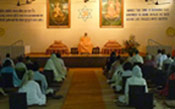 Swamiji and devotees in the meditation hall